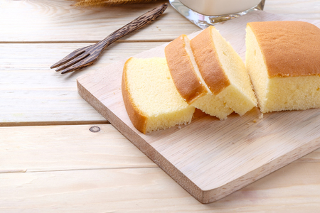 Butter cake on wooden backgroundの写真素材