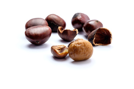 Roasted chestnuts on a white background.の写真素材