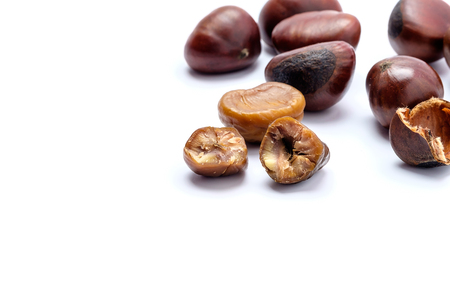 Roasted chestnuts on a white background.の写真素材
