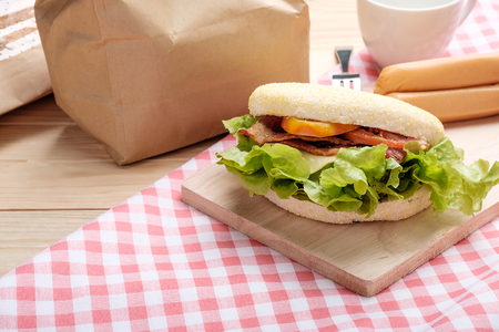 Sandwich muffins on a wooden background.の写真素材