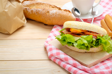 Sandwich muffins on a wooden background.の写真素材
