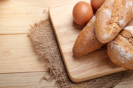 Whole wheat bread on wooden backgroundの写真素材