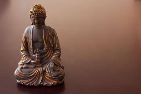 figure of Buddah on the tableの写真素材