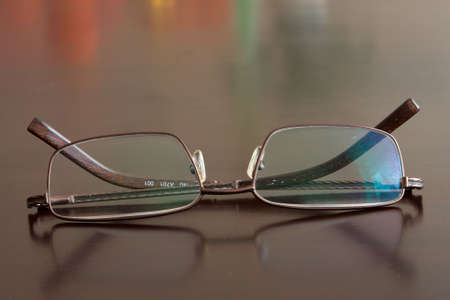close-up of glasses on dark brow table topの写真素材