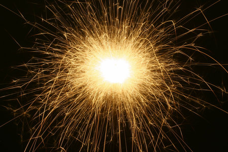 close-up of electric sparkler on dark background