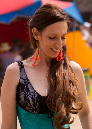 One of many women dressed in period costume at the Renaissance festival in the Phoenix area. Each played a role whether merchant, musician, particpant or visitor.のeditorial素材