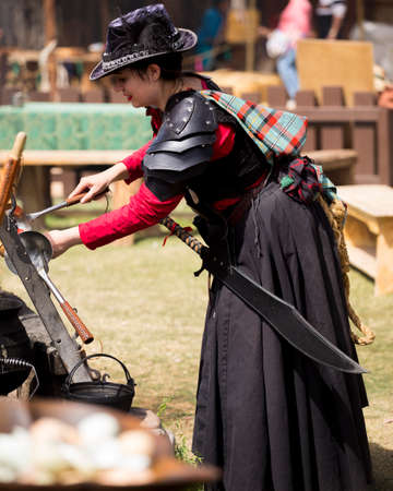 One of many women dressed in period costume at the Renaissance festival in the Phoenix area. Each played a role whether merchant, musician, particpant or visitor.のeditorial素材