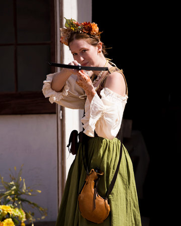 One of many women dressed in period costume at the Renaissance festival in the Phoenix area. Each played a role whether merchant, musician, particpant or visitor.のeditorial素材
