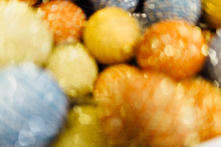 Blurred abstract golden background with christmas ornamentの写真素材