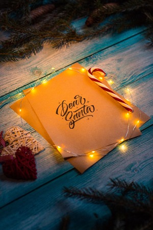 Letter to Dear Santa on a blue wooden table in the Christmas spirit.の写真素材
