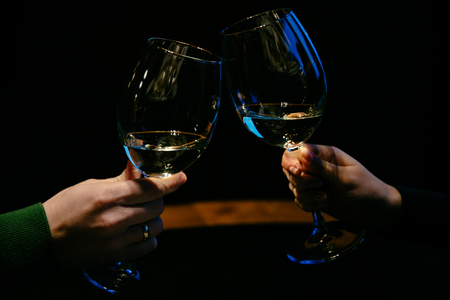 Hands with glasses of champagne. Family couple. Close-up.の写真素材