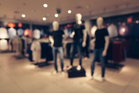 Men's clothing store. Blurred image of mannequins in men's fashion store. Abstract blurred of shopping mall boutique interiorの写真素材