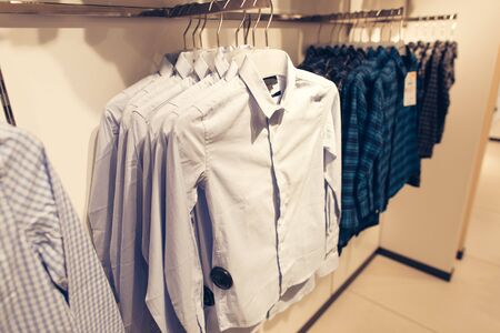 Men clothes shopping store. Men shirt in store redy for saleの写真素材