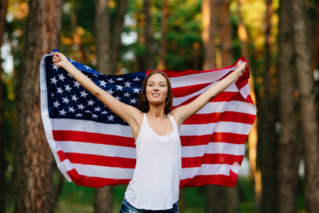 Girl waving American flag.