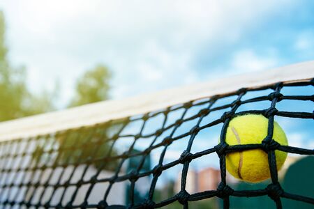 Close-up photo of tennis ball hitting to net. Sport concept.の写真素材