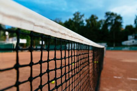 Tennis net on a tennis court background. Close-up.の写真素材
