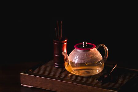 Blooming Tea. Flowering tea in teapot on a tea desk chaban.の写真素材