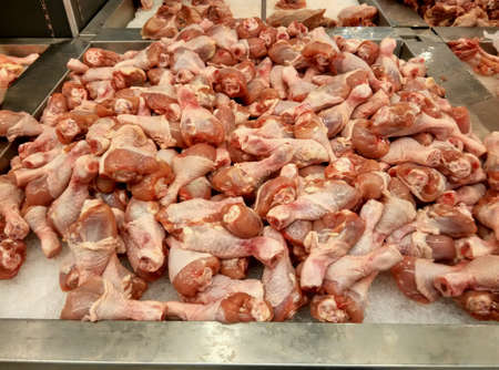 Chickens drumstick on the ice at wet marketの素材