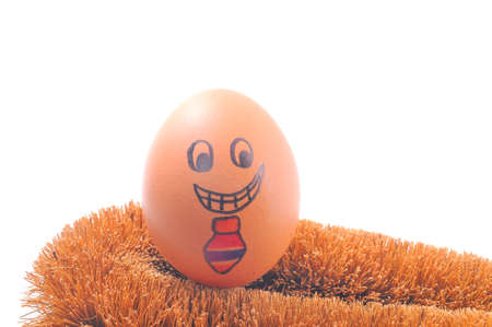 Smile egg with red necktie on the husk over white backgroundの写真素材