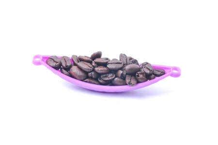 Coffee bean in the purple basket on white backgroundの写真素材
