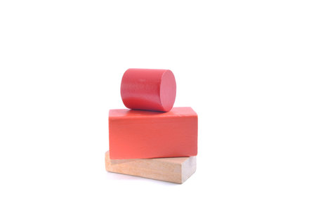 Children\'s wooden blocks of different colors on a white background