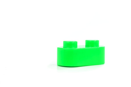 Toy colorful plastic blocks isolated on white background