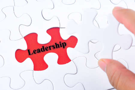 Missing jigsaw puzzle piece with word Leadershipの写真素材
