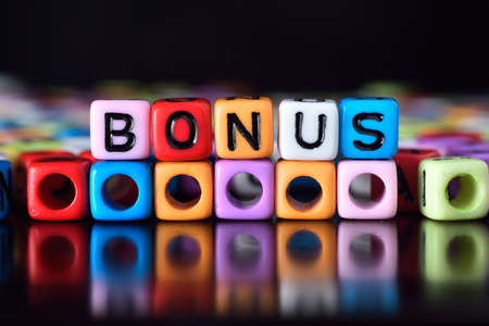 Bonus on colorful diceの写真素材