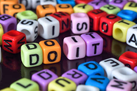 Do it surrounding by alphabets diceの写真素材