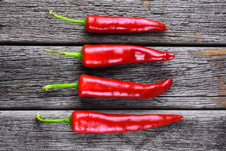 Red chilies on the rusty wooden table