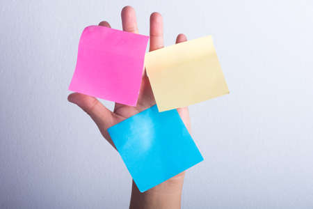 A colorful notepad on palmの写真素材