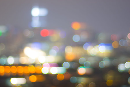 Abstract background with bokeh defocused lights of city