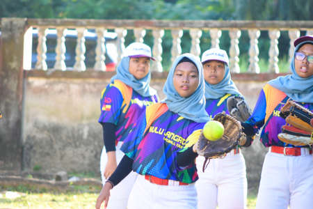 KUALA LUMPUR MALAYSIA,FEBRUARY 25th 2020: Kids plays amateur softball in park.のeditorial素材