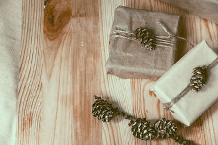 Handcrafted presents with pine cones. copy spaceの写真素材