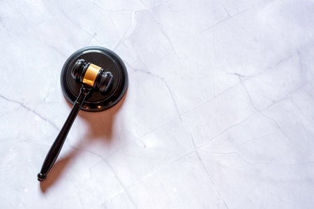 Judge's hammer on white marbleの写真素材