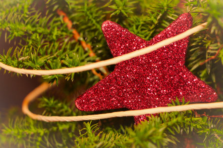 Sparkling red christmas star. Macro closeup of the wonderful glowing symbol xmas