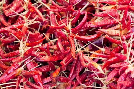 Heap of plenty red dried hot pepper for healthy nutrition. Delicious hot peppers for eg vegetarian...