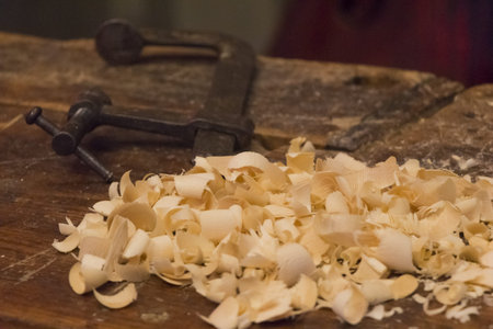 Wood craftsmanship business handmade sawdust on old workbench. Wooden handiwork tools in traditional...