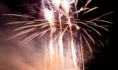 Luxury fireworks event sky show with colorful big bang stars. Premium entertainment magic star firework at eg New Years Eve or Independence Day party celebration. Black dark night background.の写真素材
