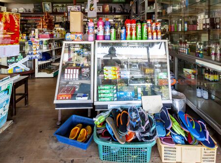 Ratchaburi, Thailand-April 14, 2018: Consumer goods shop Thai at Lak Ha Floating Market, Damnoen Saduak District.のeditorial素材