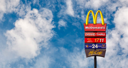Samut Prakan, Thailand - 30 October 2022 : McDonald's logo and Drive Thru sign on a sunny day, McDonalds Restaurantのeditorial素材