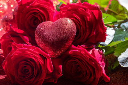 Roses and valentine red heart on red background. Valentines Dayの写真素材