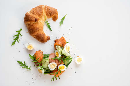 Croissant Sandwich with cucumber and salmonの写真素材