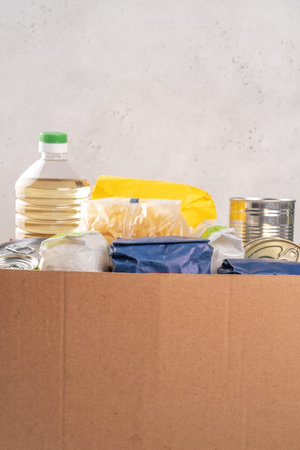 Donation box with food. Humanitarian aid.