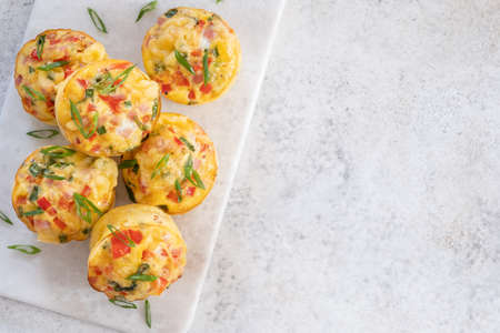Egg muffins with ham, cheese and vegetablesの写真素材