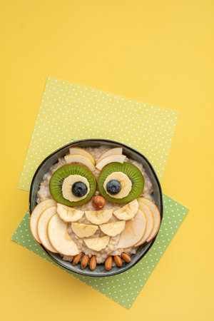 Kids breakfast porridge with fruits and nutsの写真素材