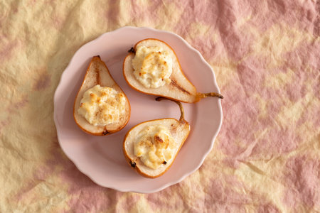 grilled pears baked with ricotta cheese and walnuts. honey toppingの写真素材