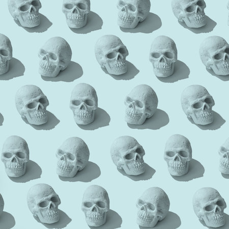 Skull pattern on pastel background. Halloween minimal concept.の写真素材