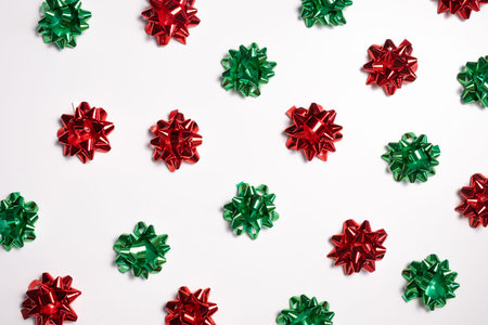 Christmas composition. a pattern of christmas gift bows. Flat lay, top view New year decor.