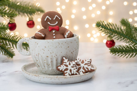 Gingerbread cookie man in a hot cup of cappuccinoの写真素材